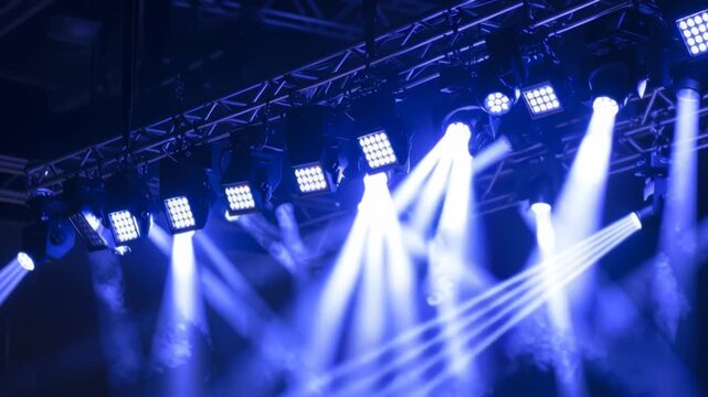 Stage lighting with spotlights being installed on aluminum concert stage	
