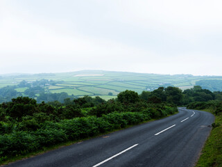 country road on bodmin moor on foggy day late spring
