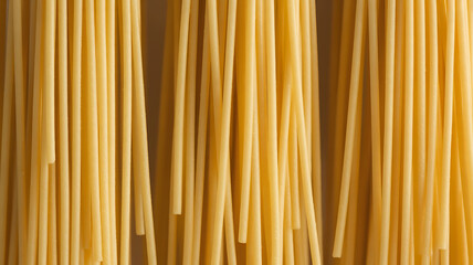 Close-up of long strands of yellow pasta.
