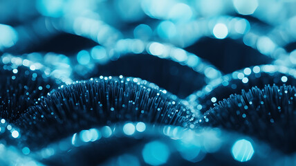 Abstract image of textured, dark blue, wavy shapes.
