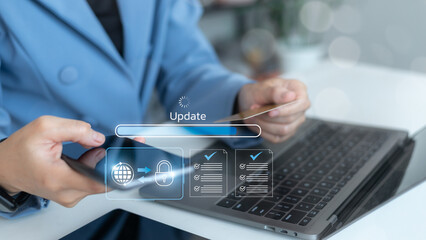 Businesswoman using smartphone and credit card while updating secure digital system with cybersecurity icons, checklist, and progress bar. Concept of data protection and fintech technology.