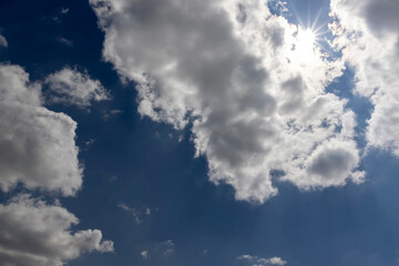 beautiful blue sky with lush white clouds in sunny bright weather