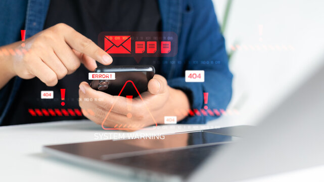 Close-up of hand holding smartphone with system error warning, 404 alert, and red email threat icons. Concepts of cybersecurity, mobile malware, data breach, and digital system failure.