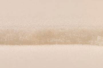 Fototapeta premium old dirty white foam for storing and transporting fragile goods close up, white foam porous structure is old and dirty after use and long-term operation