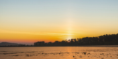 Scenic view of sea during sunrise sky background