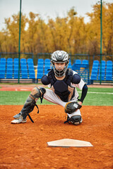 Teenage athlete showcases determination while playing baseball on a lively field