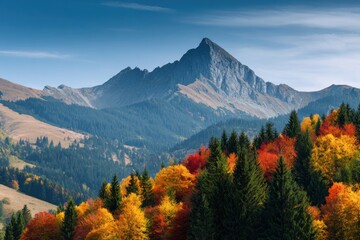 Stunning autumn mountain scenery featuring vibrant foliage and a bright blue sky for nature lovers and travel enthusiasts