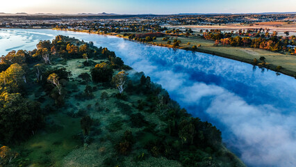 Daylight reflections on the cold river as the morning light advances.