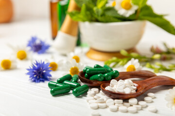 Alternative medicine herbal capsule organic drug on wooden background.Assortment of herbal and tablets,vitamins and dietary supplements.medicinal and Healing herbs.natural supplements for healthy life