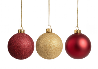 Three Christmas ornaments, red, gold, hanging