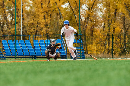 Teenage boys engage in a spirited baseball game on a vibrant field