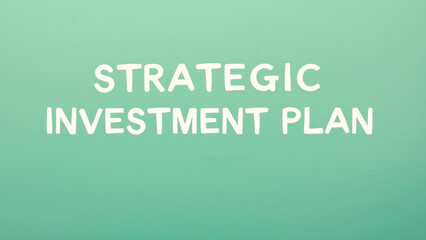 Strategic investment plan written on green chalkboard, highlighting financial planning and goal setting for investment success