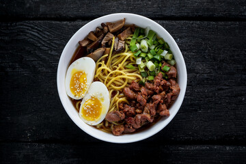 bipimbap with mushrooms, sprouts and meat on a plate
