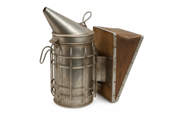 Old bee smoker producing smoke with bellows on transparent background