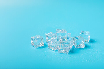 Mint and ice on texture background. Green fresh mint and ice cube. Mint leaves, ice cube and water drops for cold drink. Top view. Space for text. Copy space.