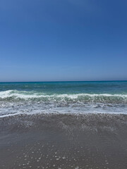 Vivid blue ocean with subtle wave patterns provides natural, soothing backdrop for various creative uses