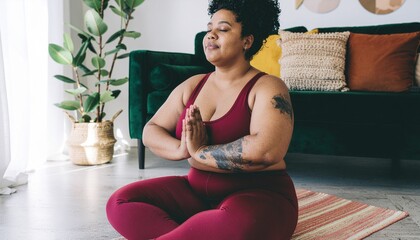 Healthy woman practicing relaxation yoga at home