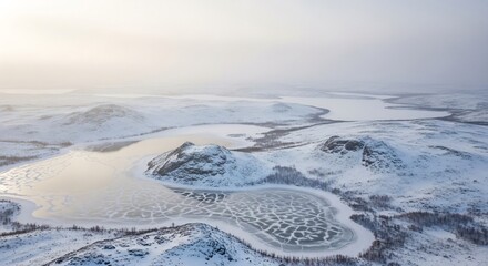 Hazy Arctic Vista Over a MosaicPatterned Frozen Lake and Snowy Mountains.