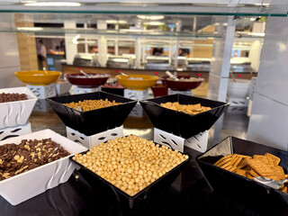 simple yet elegant breakfast bowl of dry cereal with milk served in an all-inclusive restaurant setting. Convenient hotel breakfasts, family dining, and balanced morning meals