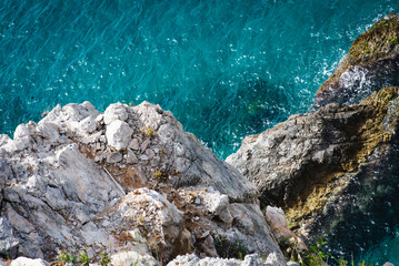 Stunning view of Calella de Palafrugell's pristine coastline featuring traditional whitewashed Mediterranean architecture, crystal-clear turquoise waters, and dramatic rocky outcrops along Costa Brava