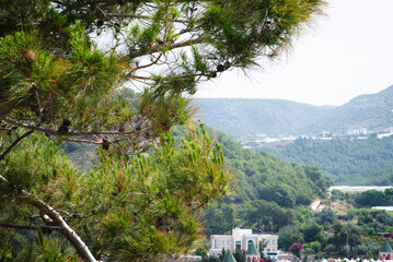 Stunning view of Calella de Palafrugell's pristine coastline featuring traditional whitewashed Mediterranean architecture, crystal-clear turquoise waters, and dramatic rocky outcrops along Costa Brava