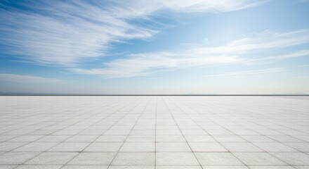 Open Horizon Tiled Floor Leads to Distant Mountains Under Blue Sky.