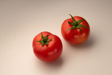 Home-grown tomatoes close-up. Ripe red tomatoes on the kitchen table