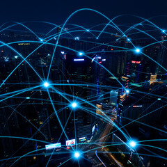 Global network connections overlaying a cityscape at night