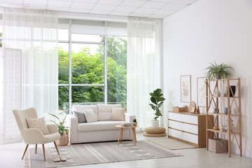 Stylish sofa and other furniture in living room. Interior design