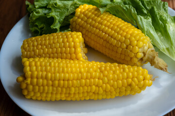 Close-up of boiled corn on a white plate