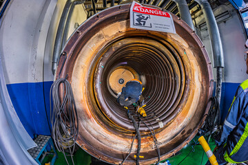 Welding male worker metal is part of machinery boiler coil tank construction repair inside