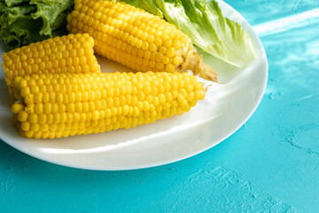 Close-up of boiled corn on a white plate