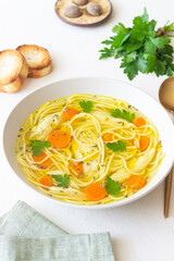 Noodle soup with chicken, carrots and greens. Healthy eating. Diet.