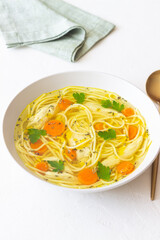 Noodle soup with chicken, carrots and greens. Healthy eating. Diet.