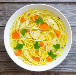 Noodle soup with chicken, carrots and greens. Healthy eating. Diet.