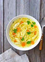 Noodle soup with chicken, carrots and greens. Healthy eating. Diet.