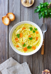 Noodle soup with chicken, carrots and greens. Healthy eating. Diet.