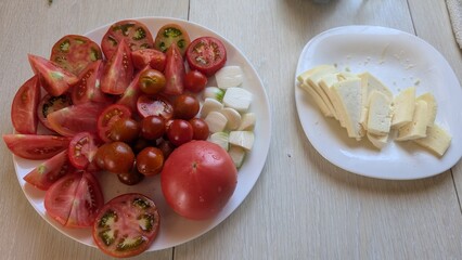 Enjoy a Fresh Tomatoes and Cheese Plate, a nutritious meal that delights the senses