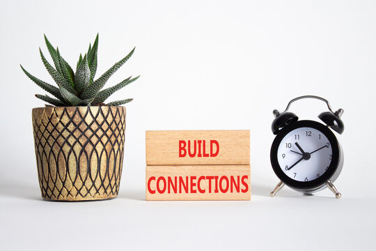 Build Connections symbol. Concept word Build Connections on wooden blocks. Beautiful white background with alarm clock and succulent plant. Business and Build Connections concept. Copy space