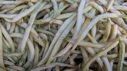A Fresh Harvest of Vibrant and Crunchy Green Beans on Display in a Local Market Setting