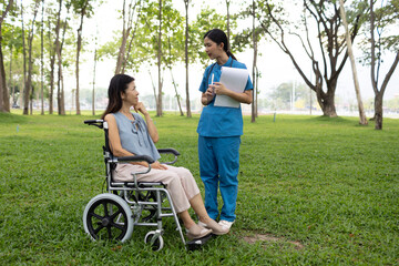 Fototapeta premium A friendly nurse assists an elderly woman in a wheelchair, providing care, support, and conversation during recovery in a retirement or healthcare setting.