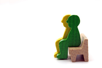 Two men figures sitting on a bench, concept, isolated on a white background

	
