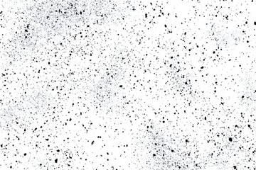 Naklejka premium Abstract monochrome texture of small dark specks scattered across a white background
