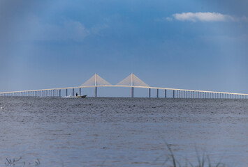 The Sunshine Skyway Bridge is an iconic suspension bridge spanning Tampa Bay, connecting St. Petersburg to the Florida mainland. Its striking architectural design, soaring over the Gulf waters, makes 