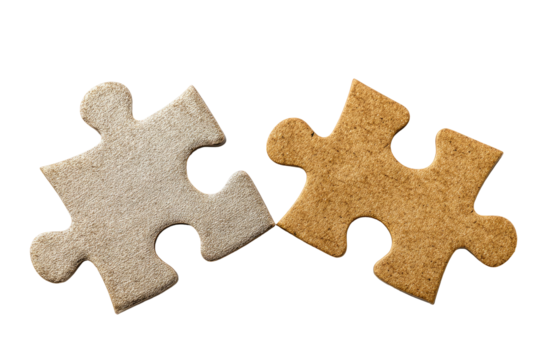 Two puzzle pieces, light beige and tan, joined edge to edge, against a black background