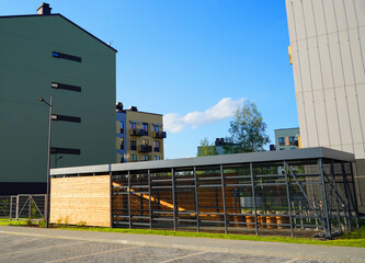 Bicycle parking in residential area at modern apartment buildings. Bicycle storage hangar at condominium complex. Modular Bike storage. Covered bicycle parking in a residential area. Bikehangar.