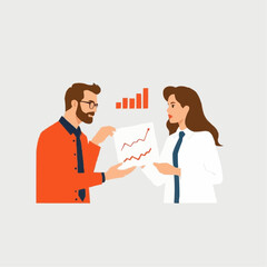 Man and woman discussing business graphs in a modern office  