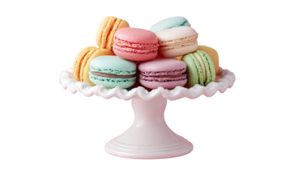 Pastel-colored macarons in a delicate, ruffled, pink pedestal dish