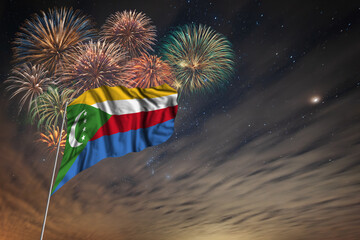 Waving National flag of Comoros and holiday fireworks