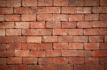 Naked orange brick wall surface. Brick texture background for design, wallpaper construction building.